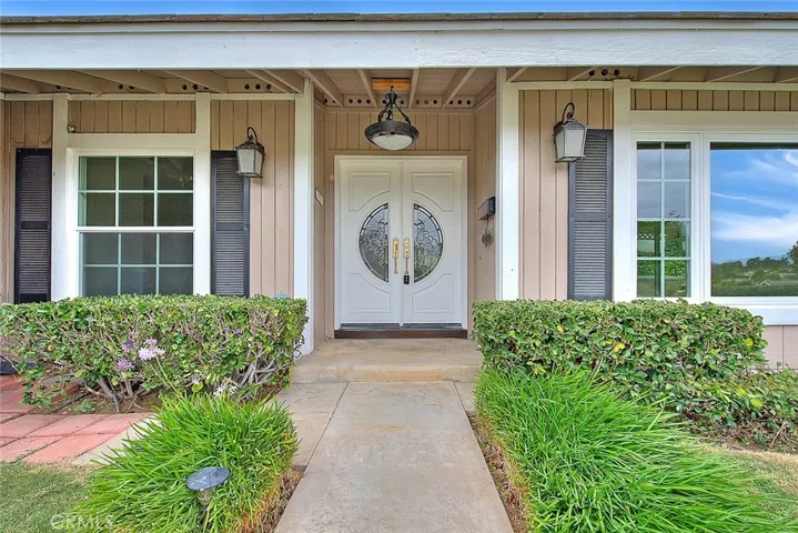 Custom doors, covered front porch.