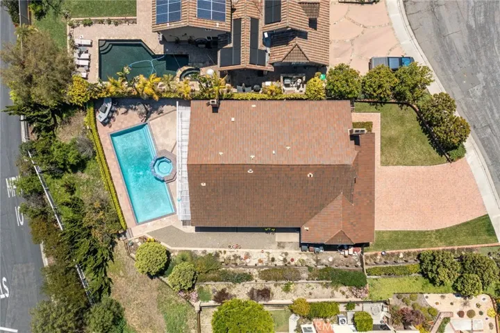 lot extends beyond pool to include tree area below