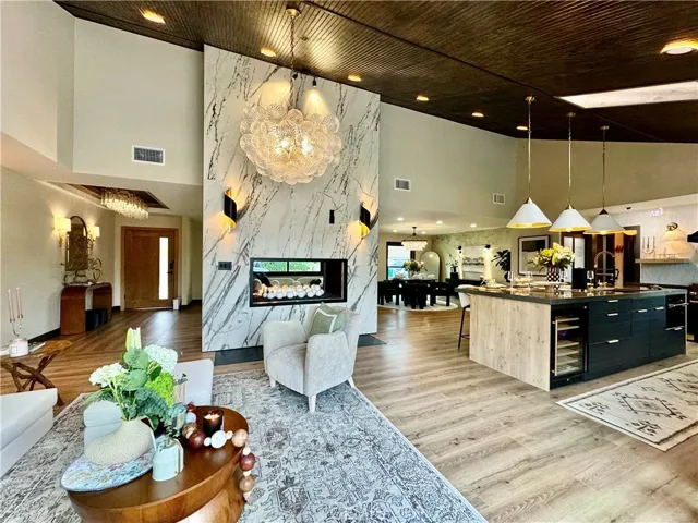 15-ft stained wood paneled ceiling in the kitchen and family room areas adds warmth and sophistication!