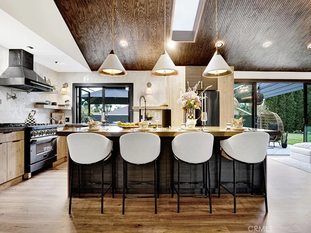 The kitchen with premium Z-line appliances, large kitchen island with Visual Comfort lighting