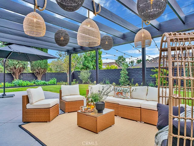 Situated on a large lot with lots of room for entertaining, hanging lights complete the ambiance