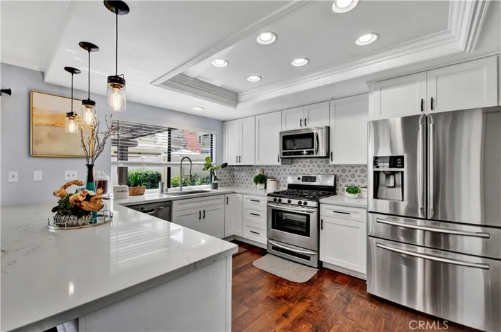Designer Details, Including contemporary Lighting elements make this large formal dining space a special place to entertain family and friends.