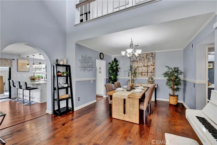 Home has Beautifully Upgraded Throughout, Inlcuding Central A/C, Soaring Ceilings, Engineered Hardwood Flooring, Crown Molding, Dual Pane Windows, Plantation Shutters, Designer Paint