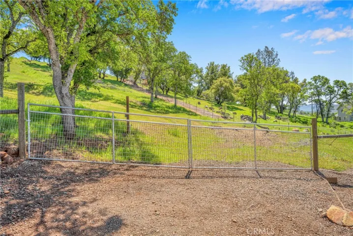 Lower gated RV parking pad with water & electricity