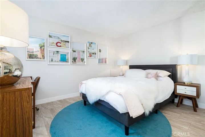Second bedroom has a wall of closets and a large window facing the second private patio.