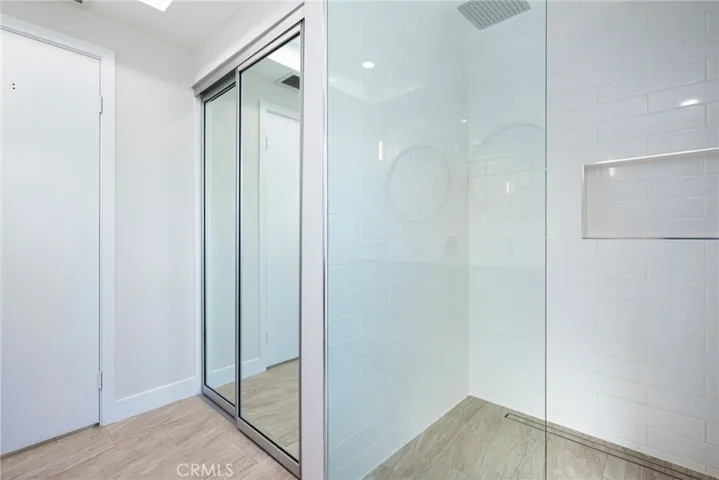 Primary bathroom has a closet for storage.
