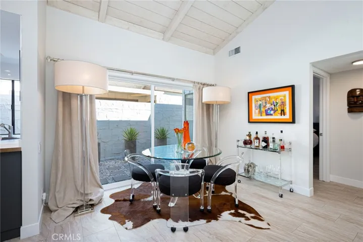Dining area opens up to a second patio with large sliding glass doors.