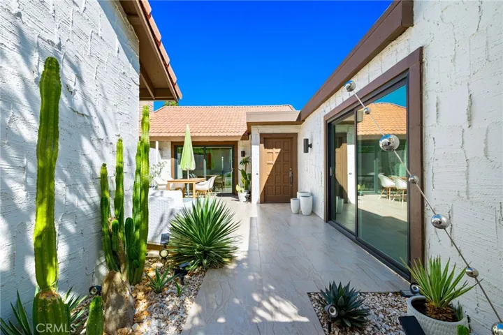 Patio flooring matches inside flooring to create seamless transition of outdoor and indoor.