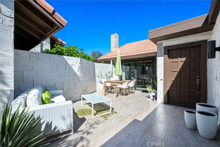 Passed the front gate you are welcomed by a large enclosed private front patio.