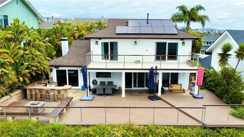 View of the back of the house and deck/yard