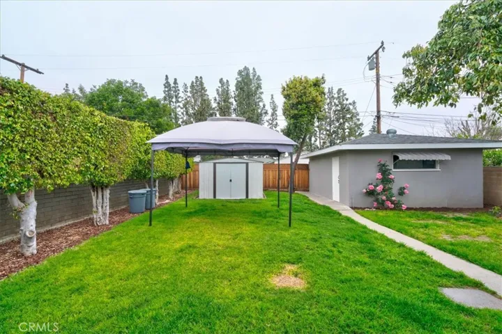 Backyard x View of Garage and Shed