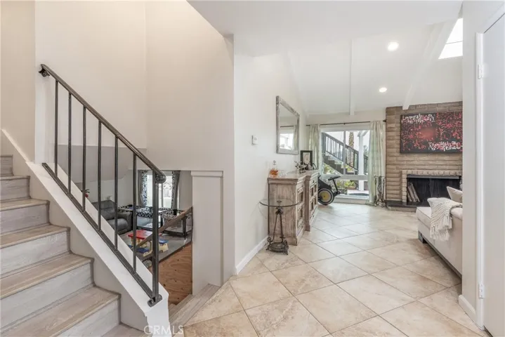 Entry showing stairways to downstairs and upstairs bedrooms