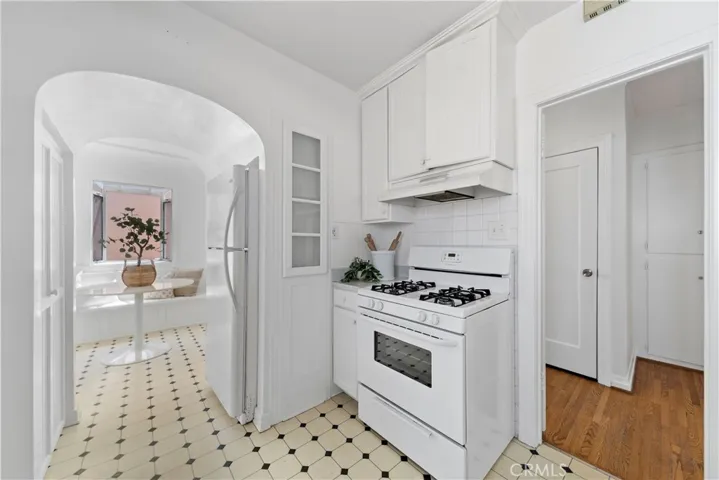 Abundant cabinetry can be found throughout the home and the kitchen is no exception. Across from the fridge is a panty.