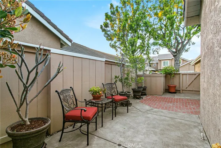 Side yard, as you enter through front gate, front door to right