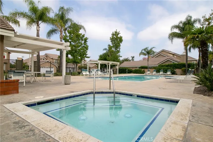 Community pool, Jacuzzi with abundant seating areas.