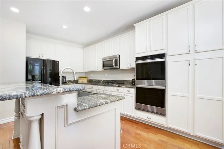 Double ovens and dishwasher are newer features.