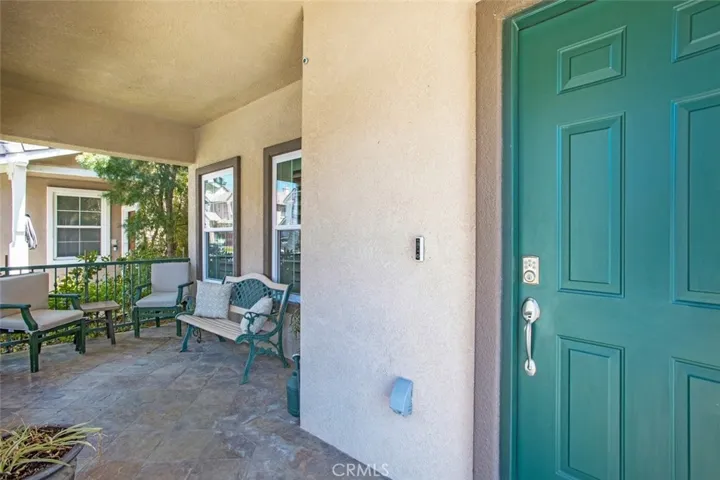 A fully covered front porch visiting area
