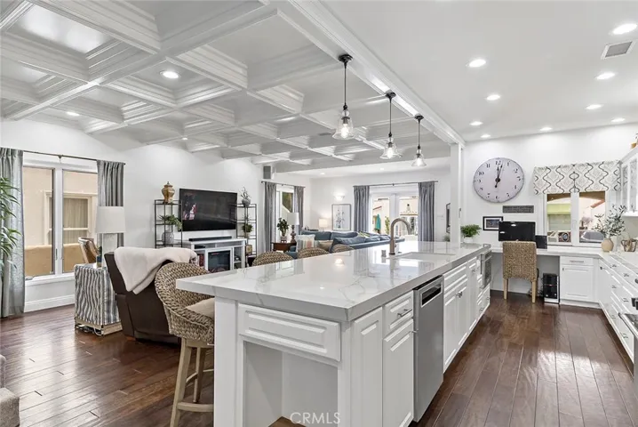 Enjoy conversing with your guests from the kitchen to the living room