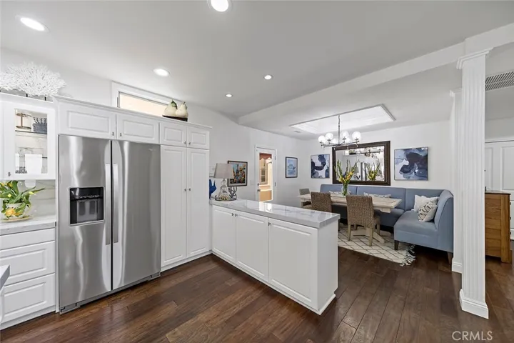 Elongated peninsula leads to dining area.