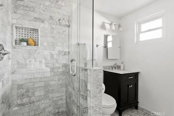 Primary bathroom attached to primary bedroom.