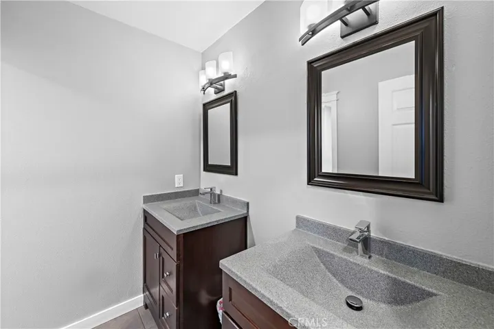 Upstairs secondary bathroom with dual vanities.  The toilet and shower/tub are separate making it easy for more than one person to get ready at a time.