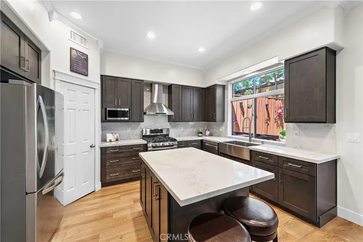 Everything about this kitchen should be appreciated, but especially the walk-in pantry and the island with extra seating.