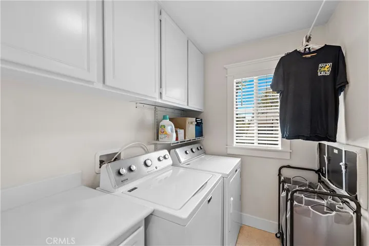 You asked for it and you got it-an upstairs laundry room with plenty of cabinets for linen storage or cleaning supplies.