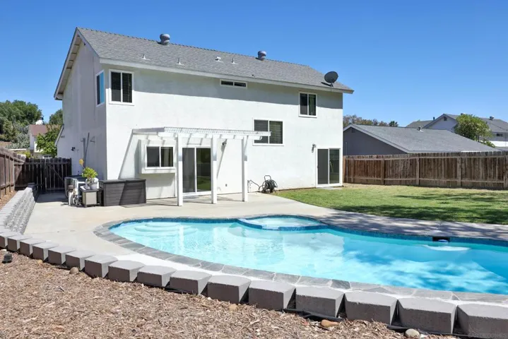Sparkling pool & spa AND spacious lawn area