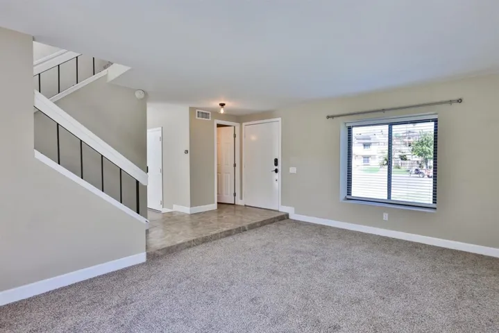 Front entry with powder bathroom to the left of the front door