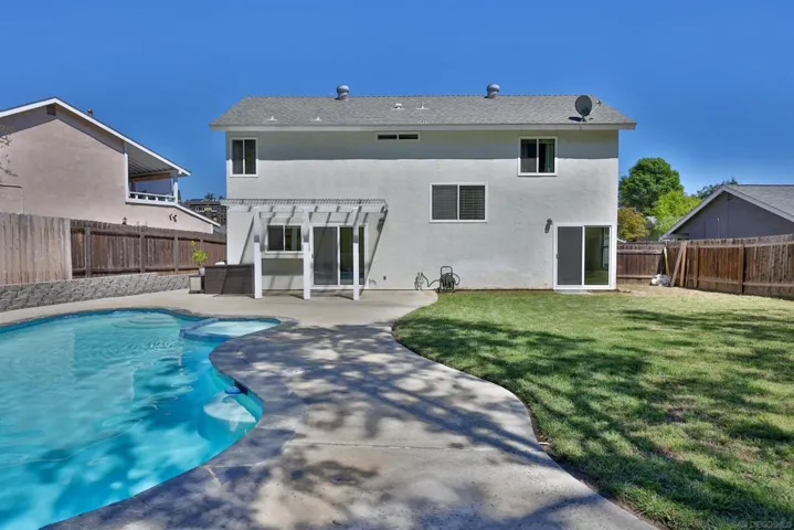 Sparkling pool & spa AND spacious lawn area