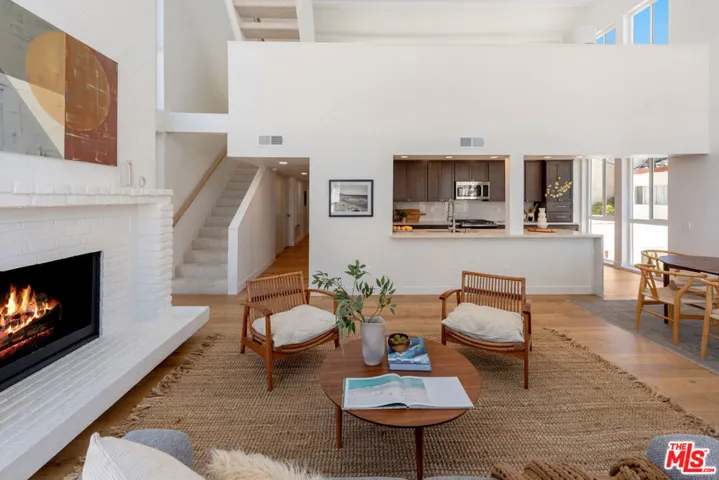 Main Floor | Living Room | Decorative Fireplace | Stairs To Loft & Decks