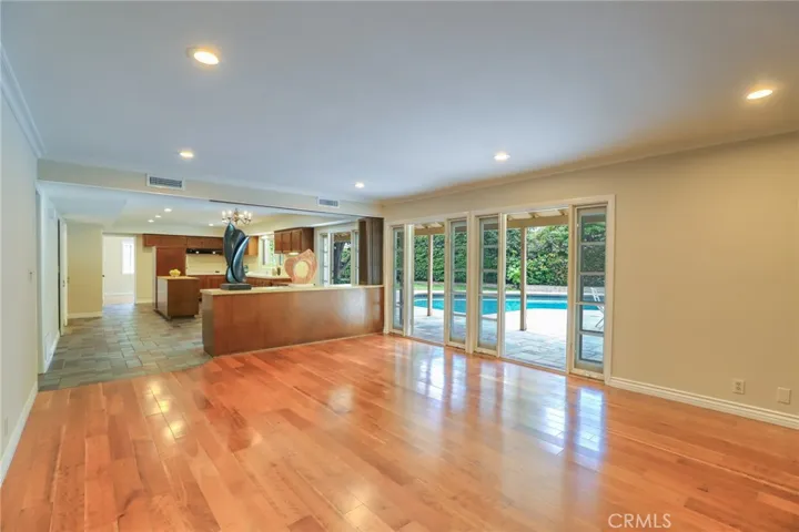 Family room looking towards the kitchen with views to the amazing lush private backyard!