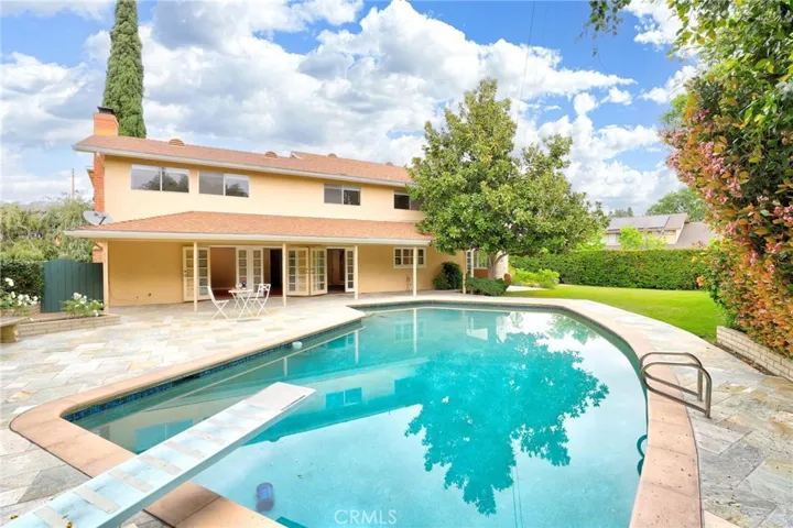 The extra large private backyard with covered patio, large grassy area with gorgeous stone decking...what a view!