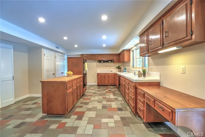 The bright kitchen, with lots of great storage!