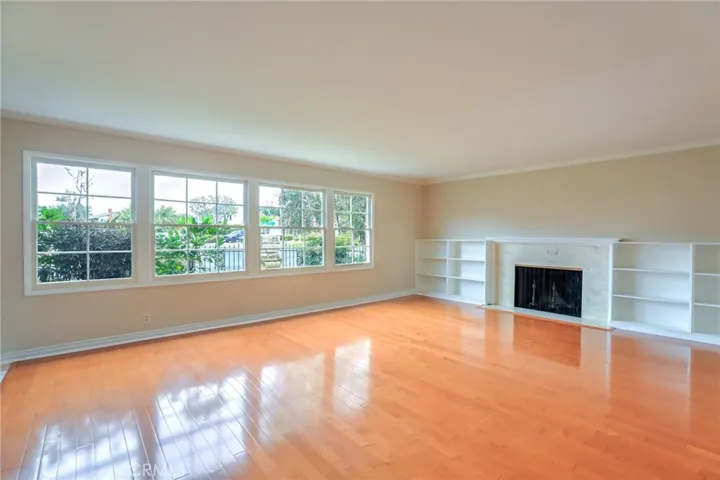 The living room with large windows for an abundance of natural light!