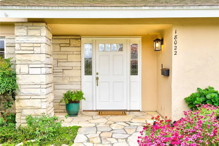 Welcoming from porch with stone entry.