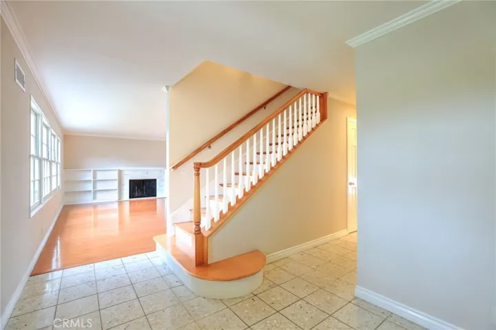 Large welcoming foyer and beautiful hardwood stairs