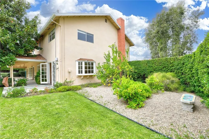 Large side yard garden with a large lemon tree.