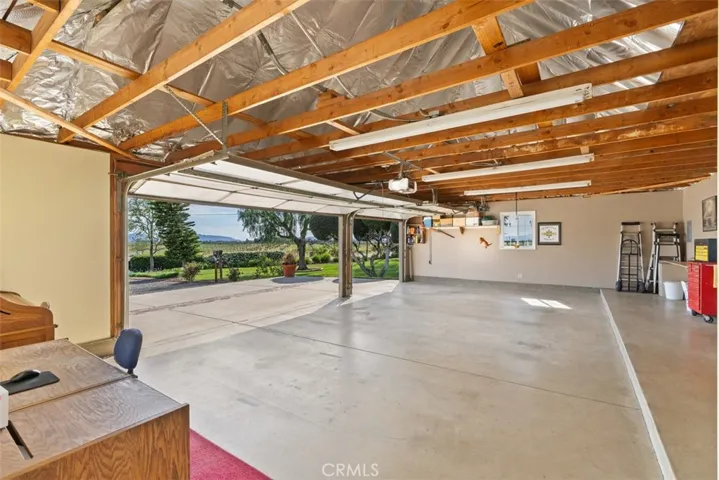 Oversize 3 car garage with high insulated ceilings