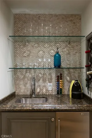 Well-appointed wet bar for entertaining guests.
