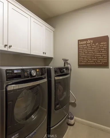 Upgraded laundry with sink and cabinets