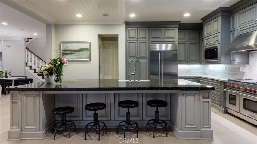 Gourmet kitchen with Wolf Stainless Steel Appliances and granite countertops."