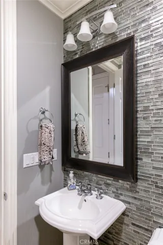 Stylish guest bathroom with designer fixtures