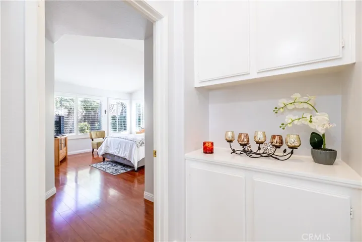 Hallway Linen Cabinets and entry to Primary suite