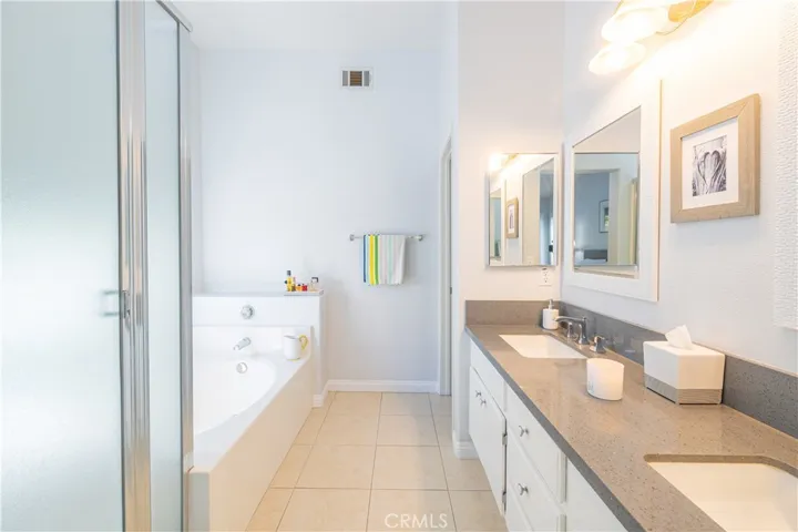 Master Bathroom with dual sinks, walk-in shower