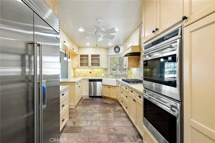 Kitchen features a built-in refrigerator and double convection ovens.
