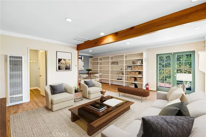 Guest house with exposed beam and bathroom.