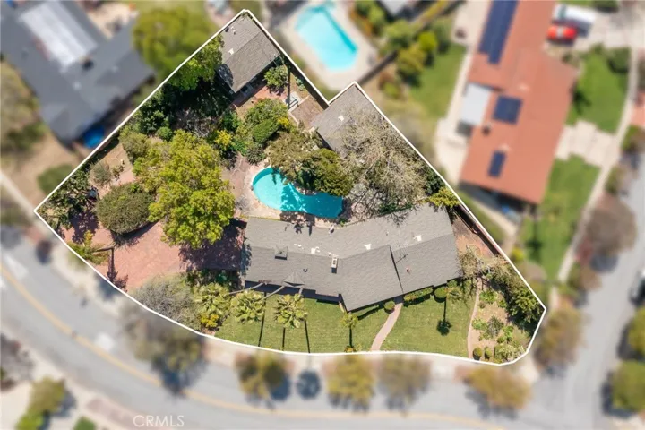 Aerial shot overhead with property boundary line.