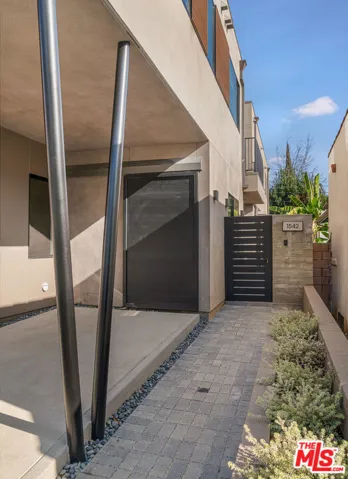 Upper Flat Carport + South Entrance