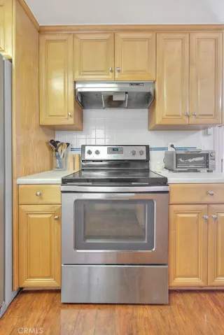 Kitchen with S/S Stove, w/ S/S Hood.